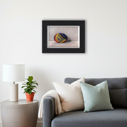 Black Framed Crème Egg Giclee Art Print in Living Room