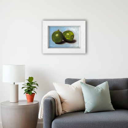 White Framed Pair of Limes Giclee Art Print in Living Room